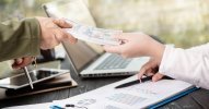 businessman-giving-money-his-partner-while-making-contract.jpg businessman-giving-money-his-partner-while-making-contract.jpg