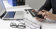 side-view-business-man-calculating-finance-numbers.jpg side-view-business-man-calculating-finance-numbers.jpg